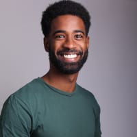 Untitled design (5) Black man smiling and happy